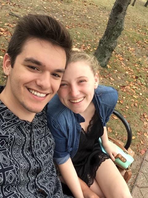 emily and clay sitting on a bench